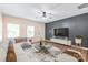 Living room with sectional sofa and large TV at 1002 Tj Dr, Monroe, NC 28112