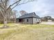 Gray house exterior with a covered porch and brick accents at 1467 Centennial Dr, Rock Hill, SC 29732