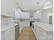 Modern kitchen with white cabinets, quartz countertops, and stainless steel appliances at 1467 Centennial Dr, Rock Hill, SC 29732