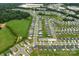 Aerial view of the community showcasing houses, yards, and a community pool in Concord, NC at 4280 Stream Dale Cir, Concord, NC 28027