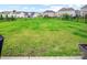 Open backyard featuring a large green lawn and a black metal fence for added security and privacy at 4280 Stream Dale Cir, Concord, NC 28027