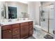 Bright bathroom featuring a double sink vanity, walk-in shower with glass door, and modern fixtures at 4280 Stream Dale Cir, Concord, NC 28027