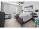 Comfortable bedroom with neutral tones, a ceiling fan, and a large window at 4280 Stream Dale Cir, Concord, NC 28027
