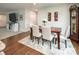 Bright dining room features a wooden table with seating for six and stylish decor at 4280 Stream Dale Cir, Concord, NC 28027