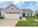Attractive home featuring an attached two-car garage and tasteful landscaping enhancing its curb appeal at 4280 Stream Dale Cir, Concord, NC 28027