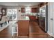 Modern kitchen featuring stainless steel appliances, granite countertops, and a center island with seating at 4280 Stream Dale Cir, Concord, NC 28027