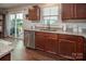 Kitchen features stainless steel appliances, granite countertops, and sliding glass doors to the patio at 4280 Stream Dale Cir, Concord, NC 28027
