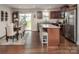 Open-concept design featuring the kitchen, dining area and backyard access at 4280 Stream Dale Cir, Concord, NC 28027