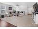 Open living room and kitchen area with carpet and wood flooring at 4280 Stream Dale Cir, Concord, NC 28027