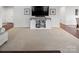 Bright living area with carpet flooring, tv, and entertainment center at 4280 Stream Dale Cir, Concord, NC 28027