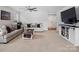 Cozy living area with plush sofas, stylish decor, and a large screen television at 4280 Stream Dale Cir, Concord, NC 28027