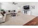 Bright and spacious living room with carpet flooring and neutral walls, enhanced by modern furnishings at 4280 Stream Dale Cir, Concord, NC 28027
