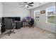 Bright office with two desks, multiple monitors, and natural light from the windows at 4280 Stream Dale Cir, Concord, NC 28027