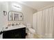 Clean bathroom with updated vanity, toilet and shower/tub combo at 905-A Linney Ln, Shelby, NC 28152