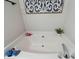 Clean bathroom with corner bathtub, updated fixtures and neutral decor at 905-A Linney Ln, Shelby, NC 28152