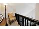 Upper hallway with sitting area, featuring comfortable chair and decorative elements at 905-A Linney Ln, Shelby, NC 28152