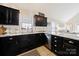 Updated kitchen featuring granite countertops and dark wood cabinets at 905-A Linney Ln, Shelby, NC 28152