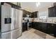 Modern kitchen with stainless steel appliances and dark cabinetry at 905-A Linney Ln, Shelby, NC 28152