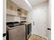 Bright laundry room with modern washer and dryer, plus extra storage at 905-A Linney Ln, Shelby, NC 28152