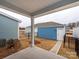 A cozy backyard patio with adjacent matching blue painted detached garages at 10507 Boudreaux St, Huntersville, NC 28078