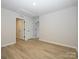 Spacious bedroom with light grey carpeting and two closets at 10507 Boudreaux St, Huntersville, NC 28078