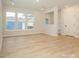Bright dining room with light wood floors and lots of natural light at 10507 Boudreaux St, Huntersville, NC 28078