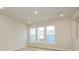 Dining room with light wood floors and three windows at 10507 Boudreaux St, Huntersville, NC 28078