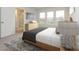 Serene main bedroom featuring natural light, a walk-in closet, and a modern en-suite bathroom at 10507 Boudreaux St, Huntersville, NC 28078
