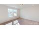 Bright bedroom with neutral carpeting and large windows at 1805 Augustine St, Monroe, NC 28112