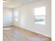 Bright bonus room with light wood flooring and large windows at 1805 Augustine St, Monroe, NC 28112
