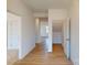 Bright hallway with light wood flooring, leading to other rooms at 1805 Augustine St, Monroe, NC 28112