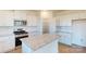 Modern kitchen with white cabinets, granite countertops, and stainless steel appliances at 1805 Augustine St, Monroe, NC 28112