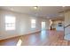 Open living room with hardwood floors and a view into the kitchen at 1805 Augustine St, Monroe, NC 28112