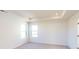 Bright bedroom with neutral carpeting and corner windows at 1809 Augustine St, Monroe, NC 28112