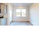 Kitchen breakfast nook with hardwood floors and access to backyard at 1809 Augustine St, Monroe, NC 28112