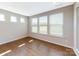 Bright bedroom with hardwood floors, large windows, and a neutral color palette, ideal for creating a serene retreat at 120 Brooke Forest Ct, Mooresville, NC 28115