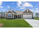 Charming single-story home with a well-manicured lawn and inviting two-car garage, creating instant curb appeal at 120 Brooke Forest Ct, Mooresville, NC 28115