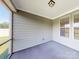 Cozy screened-in porch with ample natural light, perfect for relaxing and enjoying the outdoors at 120 Brooke Forest Ct, Mooresville, NC 28115