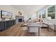 Living room with stone fireplace, hardwood floors, and ample natural light at 126 Brooke Forest Ct, Mooresville, NC 28115