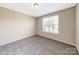 Neutral bedroom with carpet flooring and a large window allowing natural light at 132 Brooke Forest Ct, Mooresville, NC 28115