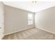Bright bedroom with plush carpet and large window offers a welcoming space at 132 Brooke Forest Ct, Mooresville, NC 28115