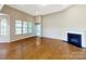 Spacious living room with a fireplace and plenty of natural light at 132 Brooke Forest Ct, Mooresville, NC 28115