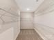 Spacious walk-in closet featuring wire shelving for optimal storage at 132 Brooke Forest Ct, Mooresville, NC 28115