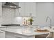 Modern kitchen details, showcasing white cabinets and a gas cooktop at 223 E Warfield Dr, Mooresville, NC 28115