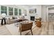 Living room featuring a fireplace and built-in shelving units at 223 E Warfield Dr, Mooresville, NC 28115