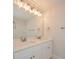 Bathroom boasts double vanity, quartz countertops and modern light fixture at 7805 Medlin Rd, Monroe, NC 28112