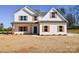 Two-story house with white siding, brown roof, and orange shutters at 7805 Medlin Rd, Monroe, NC 28112