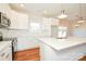 Modern kitchen with white cabinets, quartz countertops and stainless steel appliances at 7805 Medlin Rd, Monroe, NC 28112