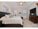 Spacious main bedroom with a ceiling fan and large windows at 5018 Grand Champion Ct, Iron Station, NC 28080