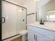 Modern bathroom with white vanity, subway tile shower, and black fixtures at 10505 Boudreaux St, Huntersville, NC 28078